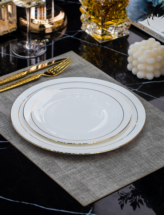 Luxury gold rim bone china flat plates, minimalist light‑luxury hotel restaurant table setting